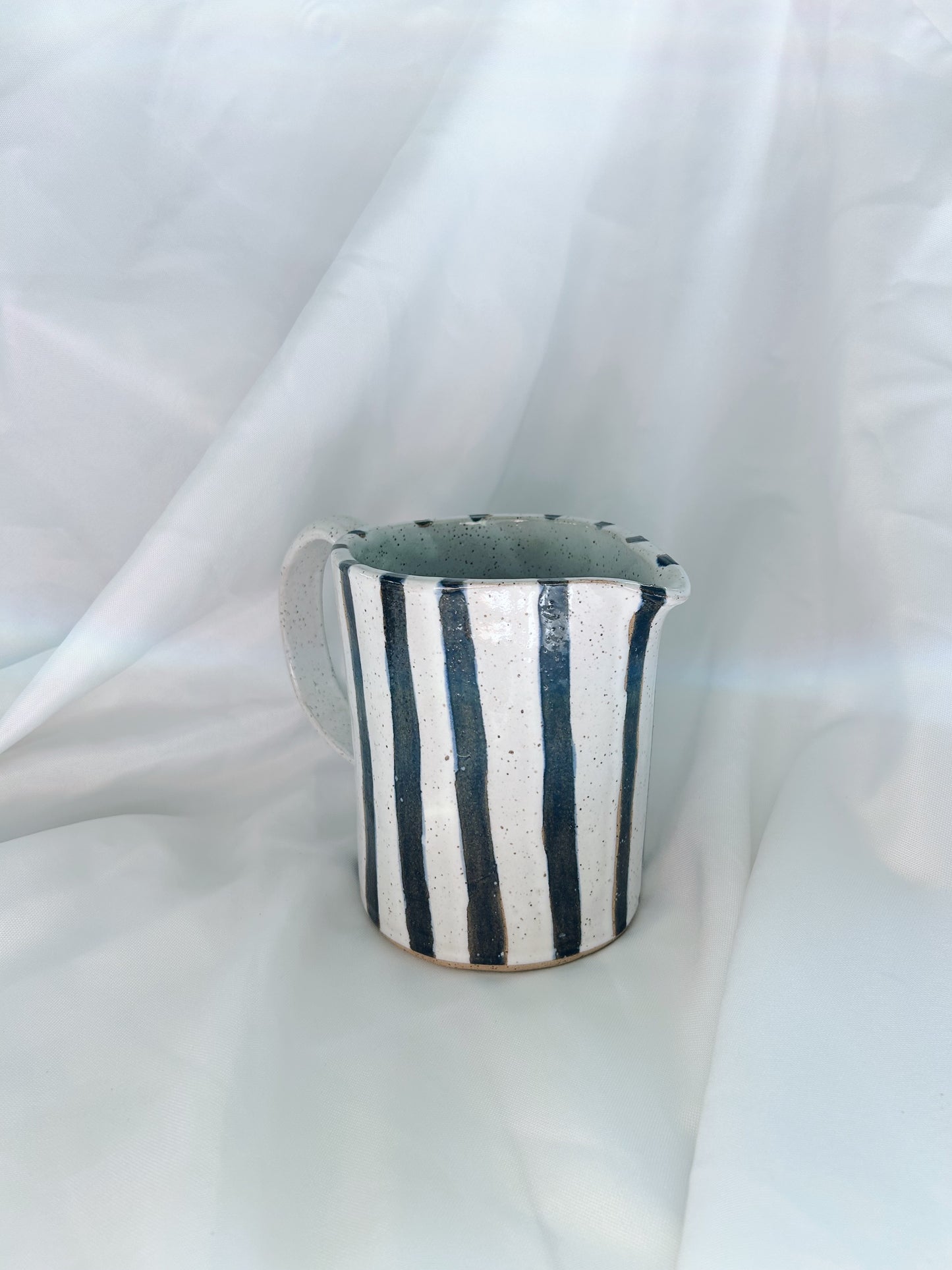 Navy striped pitcher