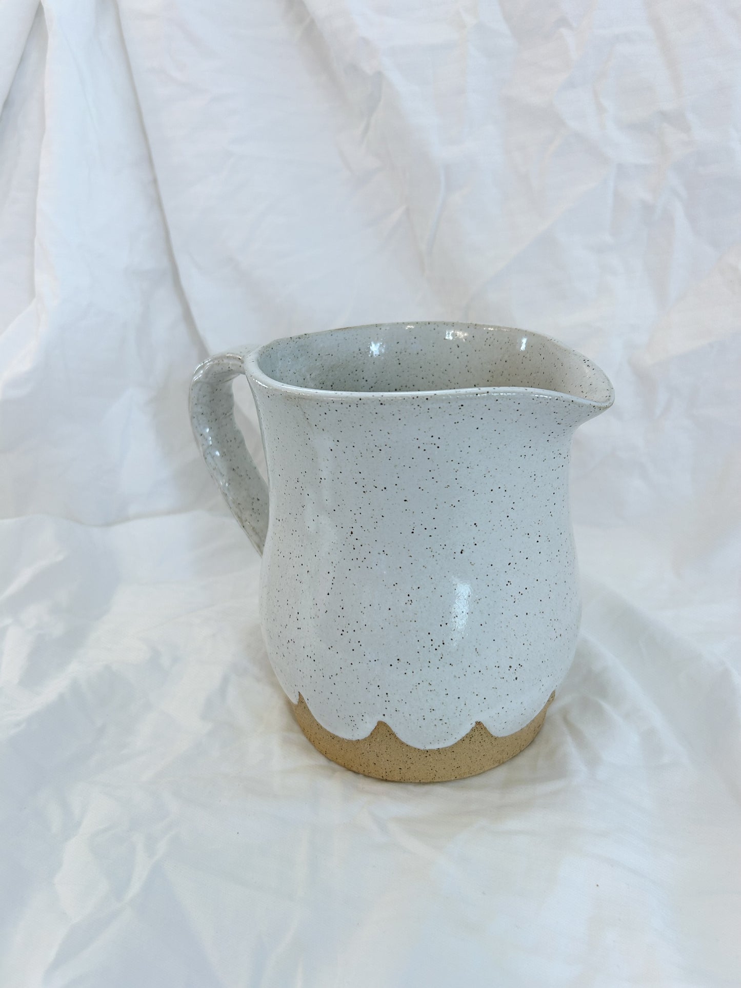 Scalloped water pitcher