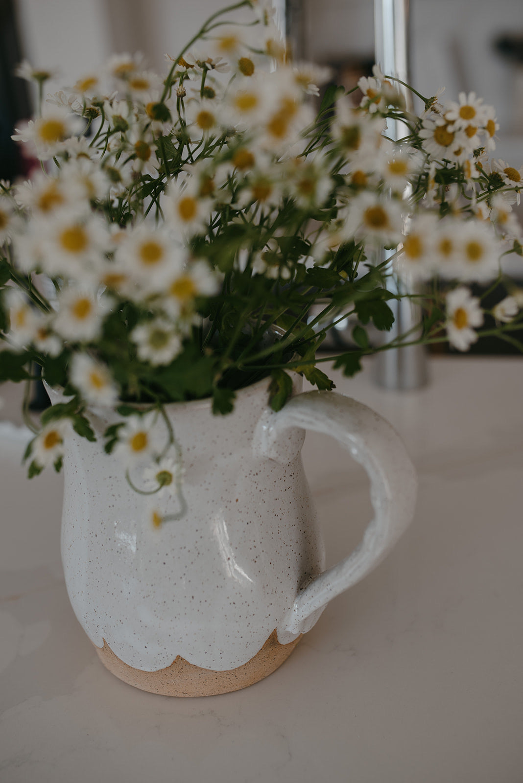 Scalloped water pitcher