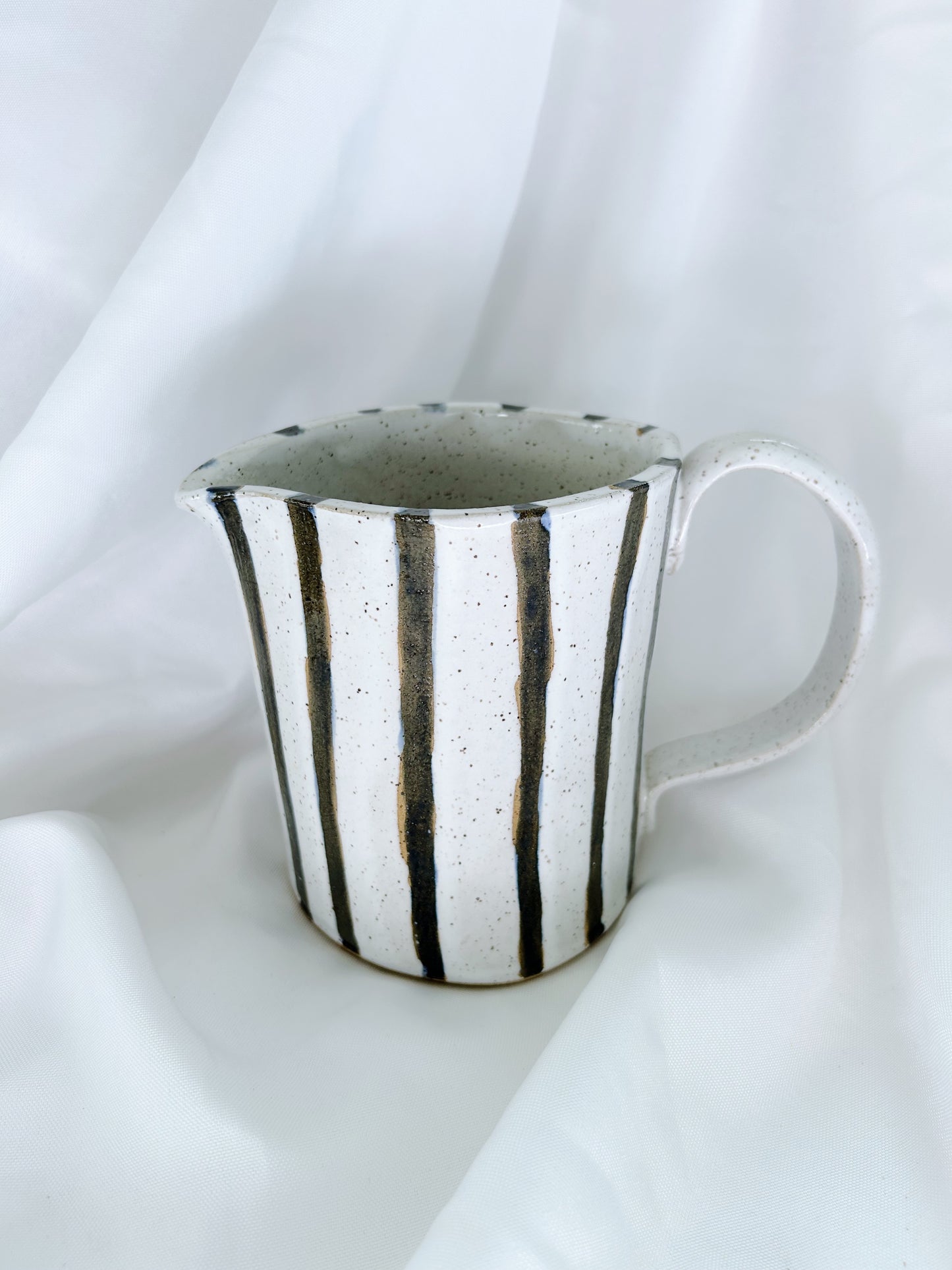 Navy striped pitcher