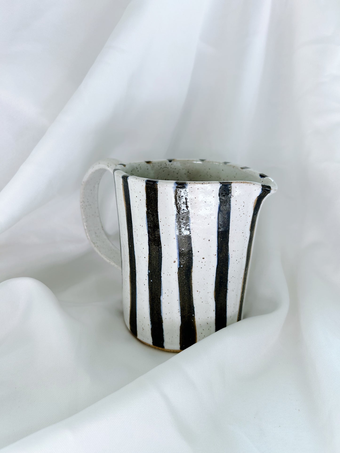 Navy striped pitcher